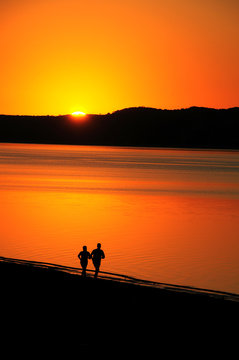 2 joggers jogging on the beach in mosambique