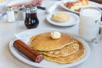 pancakes and sausage with milk