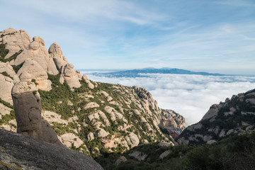 Fototapeta na wymiar View from the top of the Montserrat Mountains and the Montserrat Monastery in the lower part