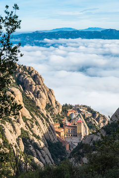 Montserrat Monastery above a sea of clouds, Catalonia, Spain