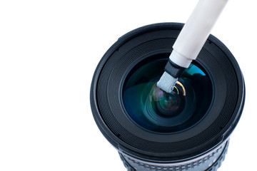the process of cleaning the lens from stains with a special brush