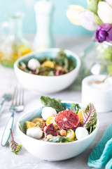 healthy salad with quinoa, vegetables and grapefruit. Vertical