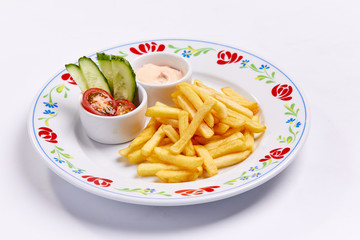 french fries with vegetables and sauce