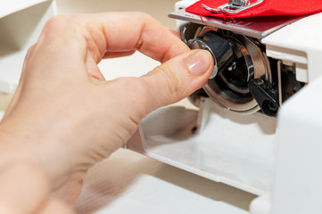 woman working on a sewing machine