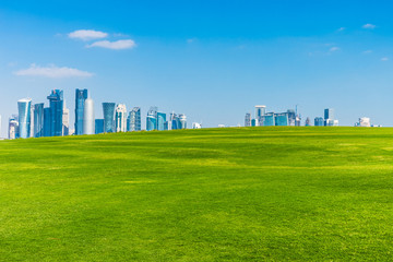 Fototapeta na wymiar The skyline of West Bay with numerous modern fast growing skyscrapers of Al Dafna, Doha, Qatar.