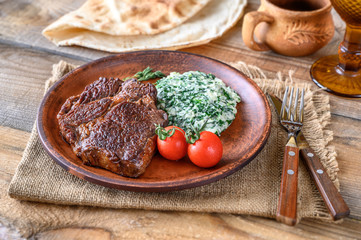 Beef steak with creamy spinach