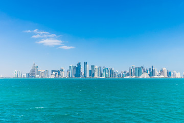 Naklejka premium The skyline of West Bay with numerous modern fast growing skyscrapers of Al Dafna, Doha, Qatar.