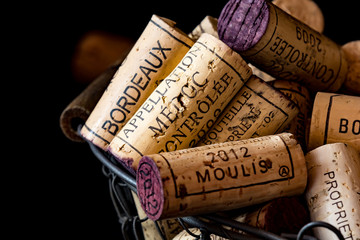 old cork stoppers of French wines in a wire basket