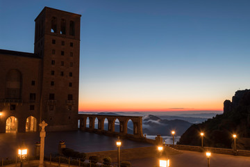Bell tower of the monastery of Montserrat, Spain at sunrise - obrazy, fototapety, plakaty