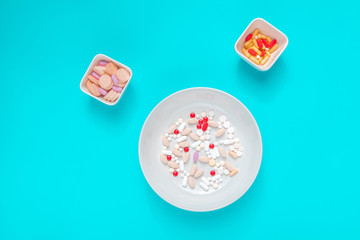 Pills and drug abuse concept top view