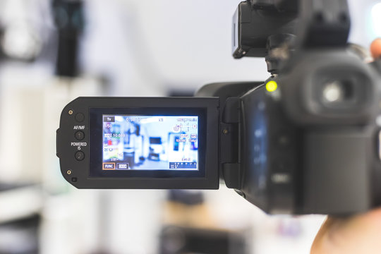 Professional Film Production: Male Filmmaker Is Recording With A Professional Movie Camera. Close Up Of Camera Lcd Screen