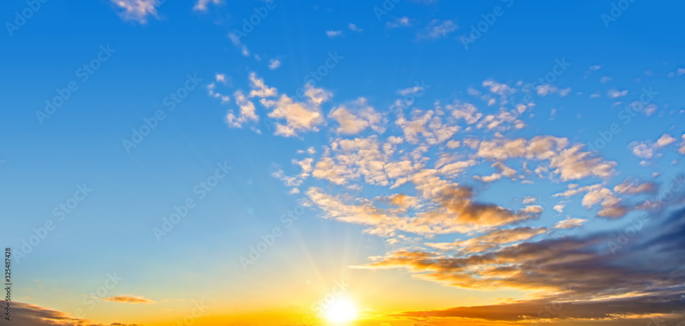 Wall mural sunset sky landscape background natural color of evening cloudscape with setting sun. ultra wide pan