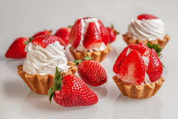 gourmet tartlets with whipped cream and strawberries