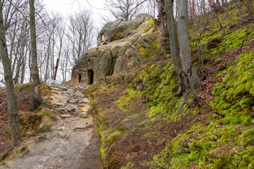 Fototapeta premium The cave monastery of the village of Razgirche is a rock-cave complex, a unique monument of history and nature. Located near the village of Razgirche, Stryi district, Lviv region, Ukraine.