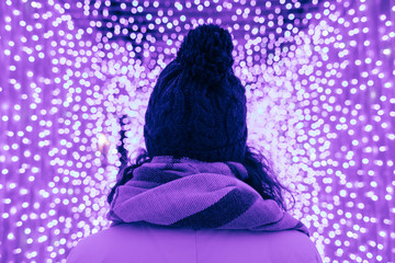 Rear view young woman in knitted hat