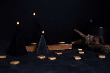 Black magic ritual with candles and runes
