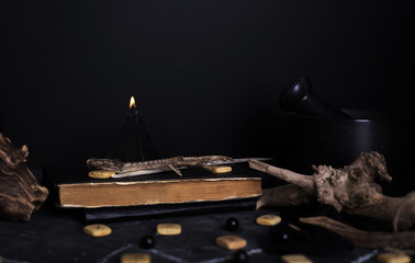 Black magic ritual with candles and runes
