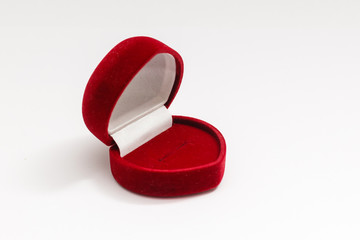 Red velvet box for the ring, opened, isolated over the white background