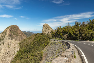 Panoramic view of Rocks - Los Roques in La Gomera island. A volcanic plug, also called a volcanic neck or lava neck, is a volcanic object created when magma hardens within a vent on an active volcano