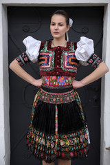 Beautiful slovak woman in traditional costume. Slovak folklore.