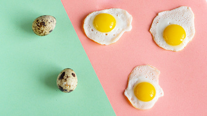 Three baked quail eggs on a pink background. And two whole eggs on a green background. 