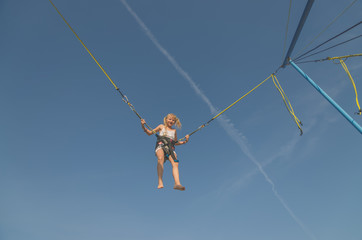 child jumping in the jumping attraction
