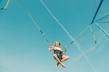 child jumping in the jumping attraction