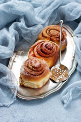 Baked sweet buns with cinnamon