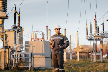 The energy engineer inspects the equipment of the substation. Power engineering. Industry