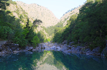 Naklejka na ściany i meble landscape with nice mountain lake with emerald water