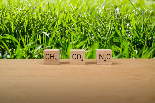 Climate report co2, ch4 and n2o pollution. Particulate air and environmental pollution from industry, transport and field wheat agriculture harvest business.