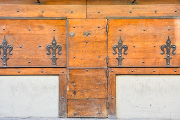 Old medieval wooden doors on the bridge Ponte Vecchio
