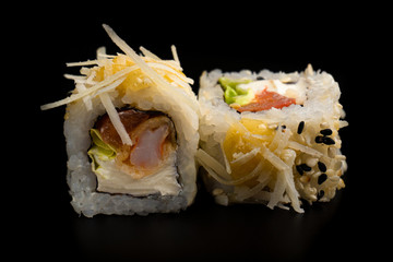Close up composition of tuna maki sushi rolls japanese food style on a black background