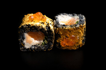 Close up composition of tuna maki sushi rolls japanese food style on a black background