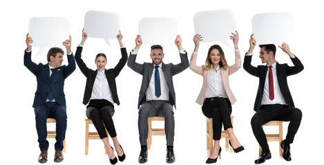 Fototapeta premium 5 happy businessmen holding empty speech bubble above their heads