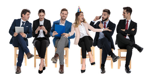 Obraz premium 6 happy businessmen celebrating birthday and holding their phones
