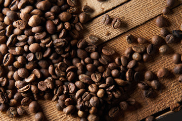 top view of raw coffee beans on a wooden surface                