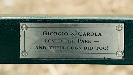 The plate on a bench from grateful visitors. Central park, New York.