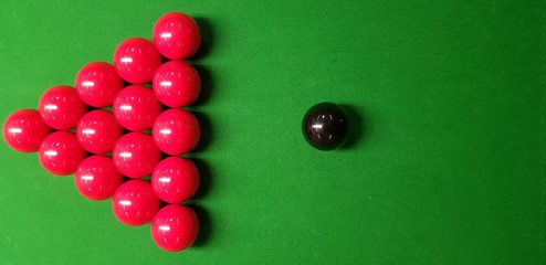 snooker balls on a green table 