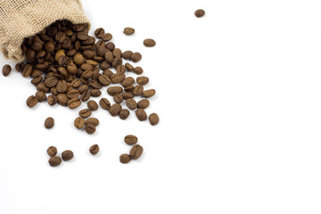 Coffee beans falling out burlap sack isolated in white background, Top view with copy space for your text message or promotional content.