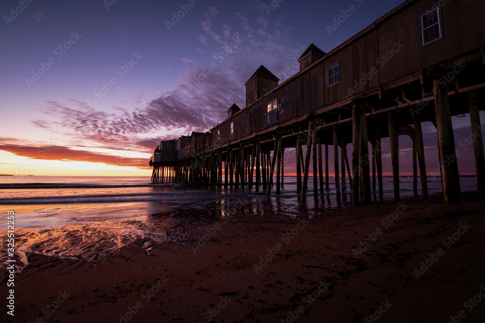 Wall mural sunrise at old orchard beach pier - old orchard beach, maine.