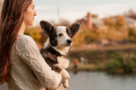 Young woman with her dog in nature colour