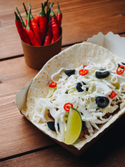 Taco mexican street food with lime and spice sauce