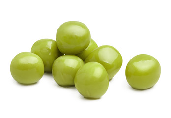 Close-up of green peas, isolated on white background