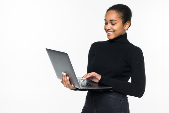 Latin woman holding a laptop - isolated over a white background