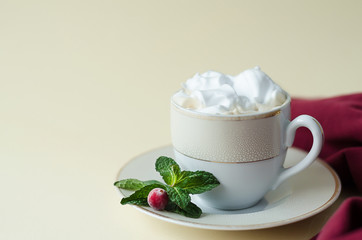 beverage, drink, coffee, cappuccino, cocoa, hot chocolate with whipped cream, cranberry, mint on yellow background with copy space.