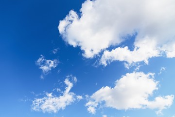 Sky background. Blue sky with fluffy white clouds. Copy space