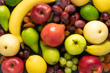 fruits background red, green and yellow color composition. Summer abstract creative trendy fresh health concept. Flat lay top view copy space.