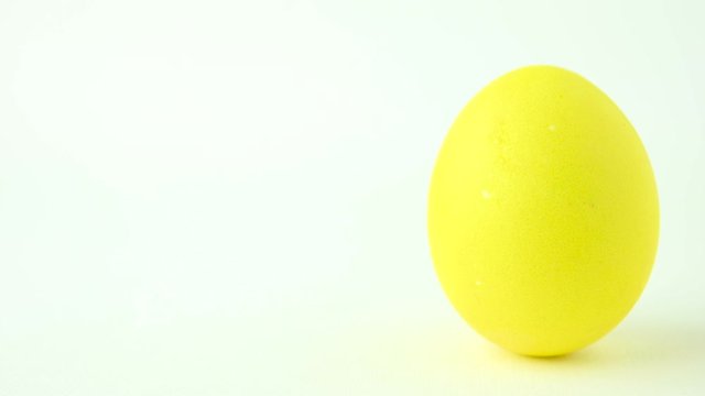 Colorful easter egg on a white background. Easter concept background.
