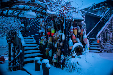 Pier 77 nautical theme decoration after snow storm - Cape Porpoise, Kennebunkport, Maine.